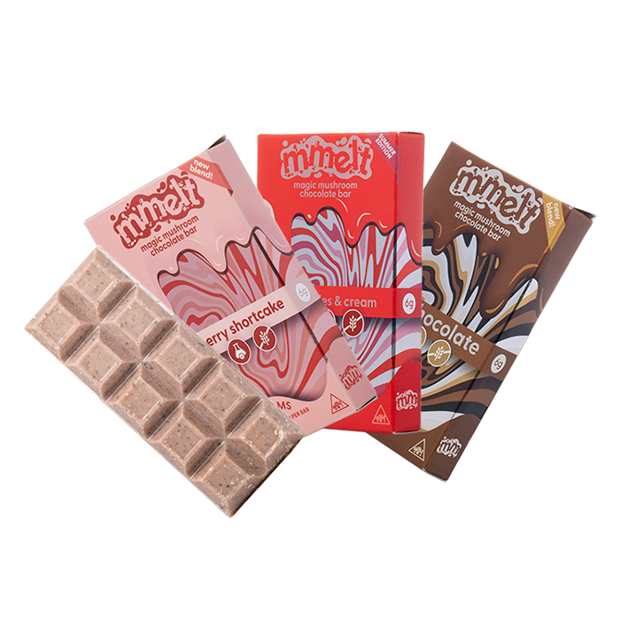 Chocolate bars and packaging with 'mmelt' branding on a white background, mmelt magic mushroom chocolate bar, magic mushroom chocolate bar mmelt, mmelt mushroom chocolate bar flavors.